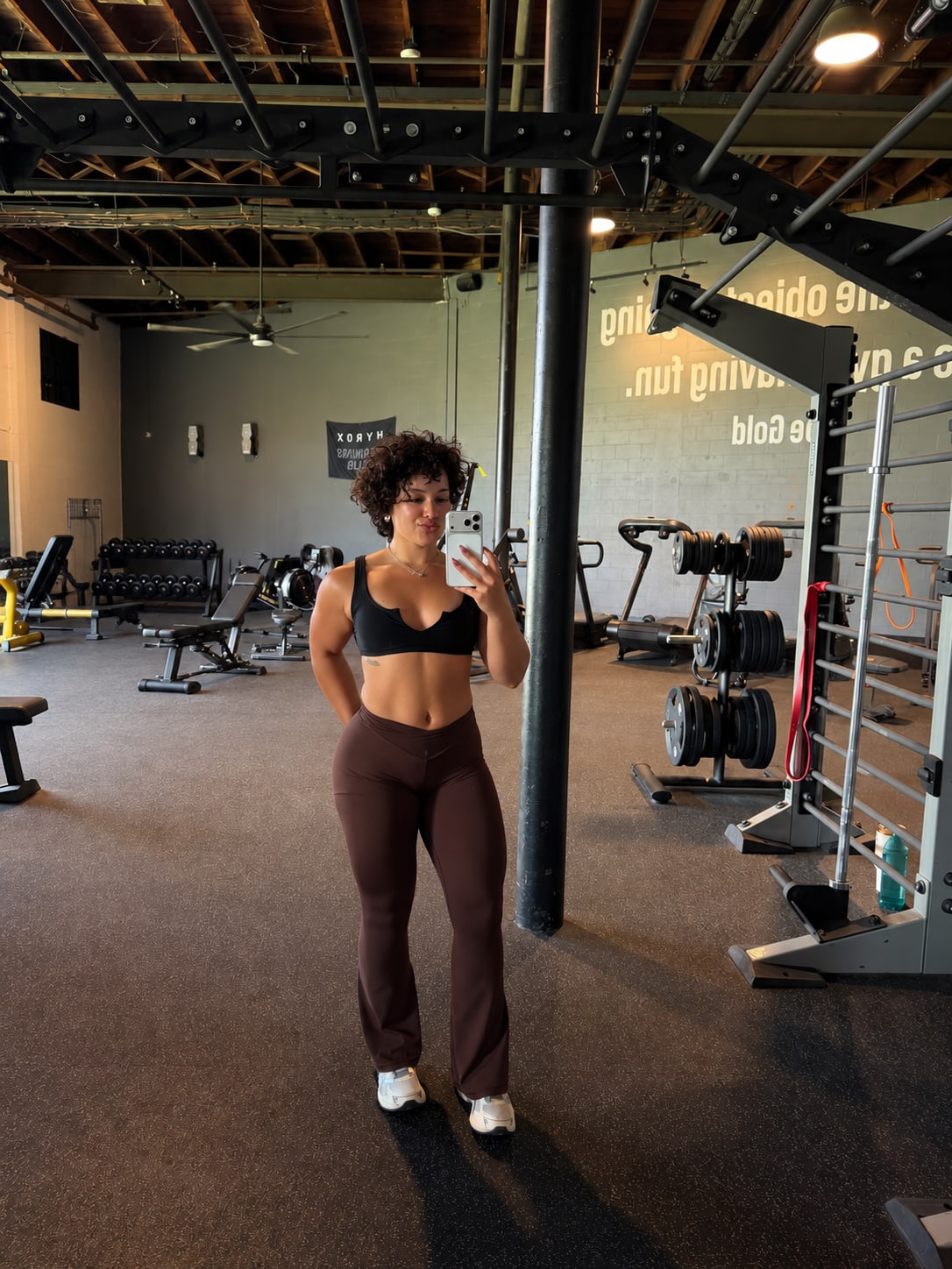Mikaela standing in a strength-training gym